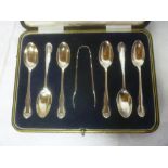 A set of six silver teaspoons and matching sugar tongs, London marks,
