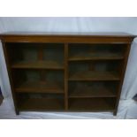 A late Victorian walnut rectangular open bookcase with two bays of adjustable open shelves