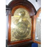 A late 18th/ early 19th Century long case clock with brass 12" arched dial by John Eveligh of