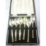A set of six silver teaspoons with decorated terminals,