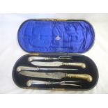 An Edward VII five-piece carving set with silver handles,