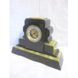 A late Victorian mantel clock with circular dial in polished black slate and green onyx angular