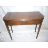 A 19th Century inlaid mahogany rectangular turn-over top tea table with decorated frieze on square