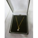A 9ct gold pendant necklace set a single diamond