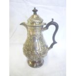 A late Victorian silver baluster-shaped pedestal coffee pot with raised flower and scroll