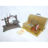 An old small size sewing machine with painted frame and a cased childs sewing machine by Grain (2)