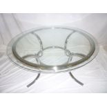 A 1970's German chromium plated circular glass top coffee table,