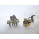 Two Austrian painted bronze miniature figures including rabbit in hat box and two children on a