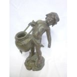 A 19th Century bronzed spelter figure of a cherub with vase on rocky base,