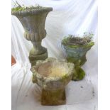 Three weathered composition garden pedestal urn's on tapered bases