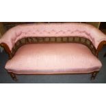 A Victorian inlaid mahogany parlour settee with curved back and buttoned pink fabric upholstery