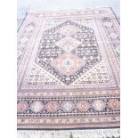 A good quality wool carpet with floral and geometric decoration 12' x 9'