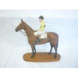 A large Beswick china figure of a jockey on a racehorse
