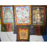 Three eastern painted fabric panels/scrolls with embroidered surrounds