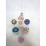Seven various glass paperweights including Laugharne and others together with a similar paperweight