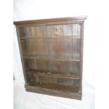 A Victorian carved oak rectangular open bookcase with adjustable shelves on plinth base