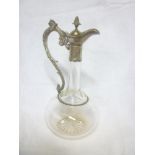 A good quality cut glass tapered claret jug with electroplated mounts and hinged lid