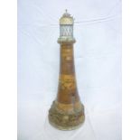 An unusual Victorian laminate & inlaid model lighthouse as a table lamp with cork rock-effect base