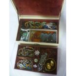 A jewellery box containing a quantity of various costume jewellery