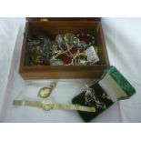 A jewellery box containing a small selection of various costume jewellery