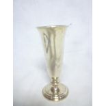 A silver tapered spill vase on circular spreading base,