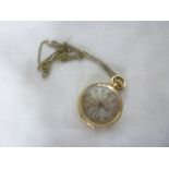 A ladies 14ct gold fob watch with silvered circular dial and engraved case