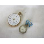 A ladies ornate silver and enamelled fob watch,