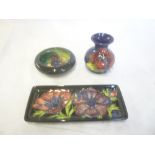 Three pieces of Moorcroft pottery including rectangular dish with anemone decoration,