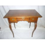 A Georgian style oak rectangular side table with three drawers in the frieze on scroll shaped legs