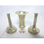 A pair of Edward VII silver tapered spill vases with raised decoration,