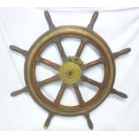 An old brass mounted mahogany ship's wheel,