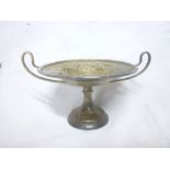 A George V silver circular pedestal bon bon dish with loop handles,