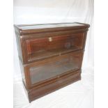 A Globe Wernicke mahogany two-tier stacking bookcase with glazed folding fronts