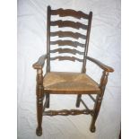 A set of four single & two carver Georgian style oak ladder back dining chairs with rush-work seats