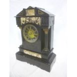 A Victorian mantel clock with circular dial and part visible escapement in black slate and grey