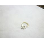 An 18ct gold dress ring with platinum shoulders set two diamonds