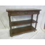 A 19th Century carved oak three-tier buffet with two drawers in the frieze on spiral turned
