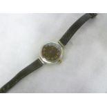 A silver Military Services watch by Buren with black circular dial and later strap