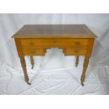 A small Edwardian oak rectangular writing desk with a single drawer in the frieze and two small