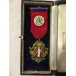 An unusual silver gilt & enamelled Devon & Cornwall Dental Incorporated Society medallion,