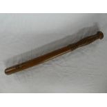 A plain turned wood Police truncheon,