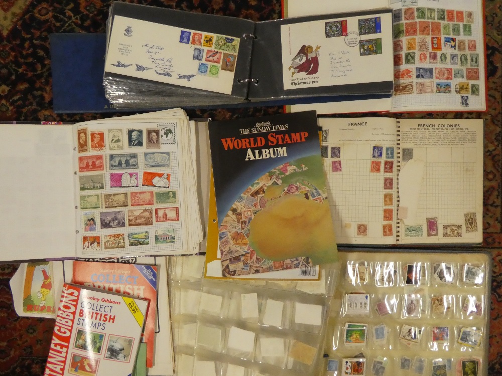 Two albums of GB and World Stamps, an album of loose GB stamps,
