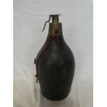 A large 19th Century brass mounted leather powder flask/powder container with locking top,
