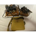 A pair of First War military X 6 binoculars by Watson dated 1917 in leather carrying case,
