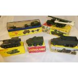 Five boxed Dinky toy military vehicles including 665 Honest John missile launcher, 817 Char tank,