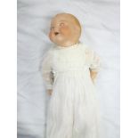 A porcelain headed baby doll by Armand Marseille with sleeping eyes,