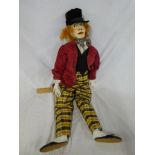 A large wooden jointed puppet depicting the Mad Hatter,