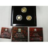 A 2018 "Lest We Forget" three piece gold sovereign set comprising gold full sovereign,