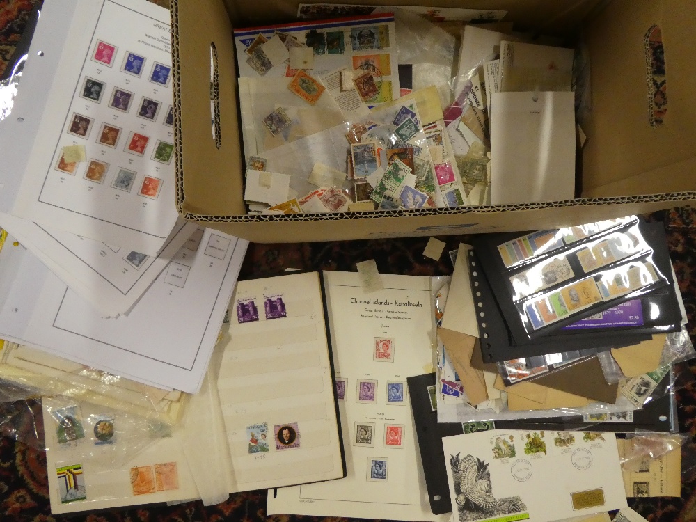 A box containing a large selection of various stamps on leaves, stock cards, loose stamps, covers,