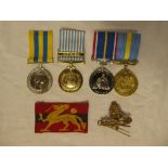 A National Service medal and Hong Kong 1997 Service Medal,